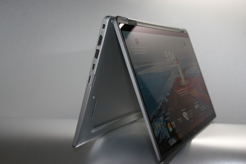 Silver Dell Latitude 7420 2-in-1 standing in tent mode, touchscreen on